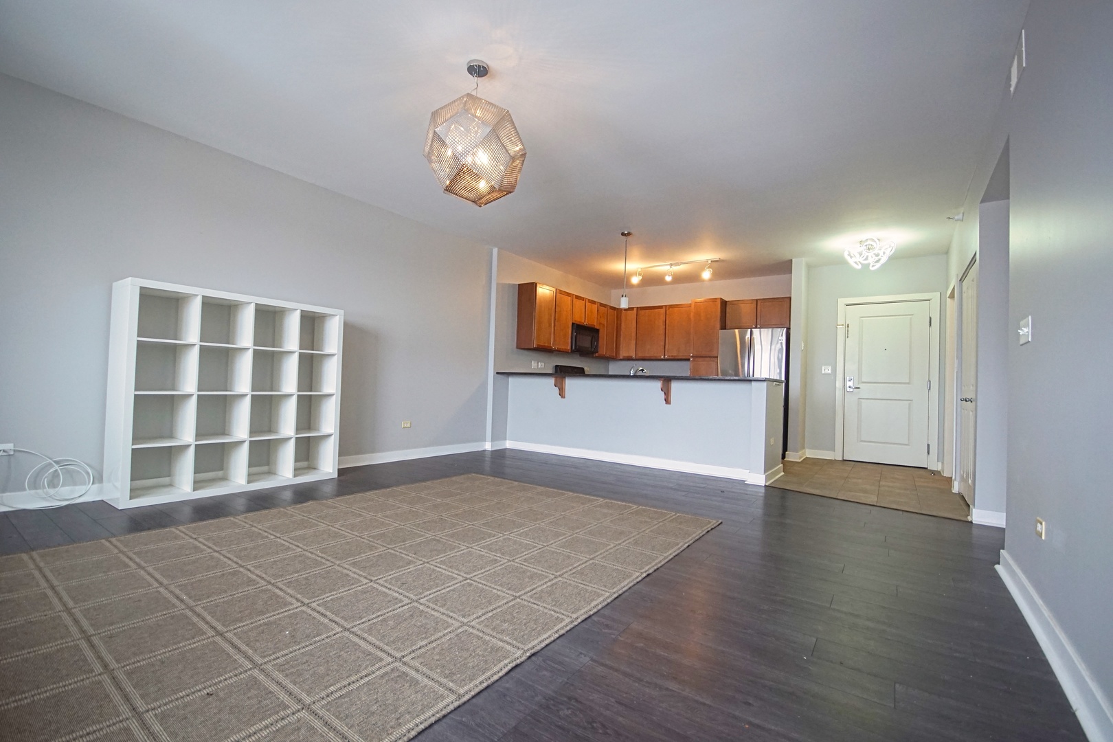 1905 South Wolf Road, Unit 401 Hillside, IL 60162 - Photo 6 of 22 an empty room with wooden floor and a window
