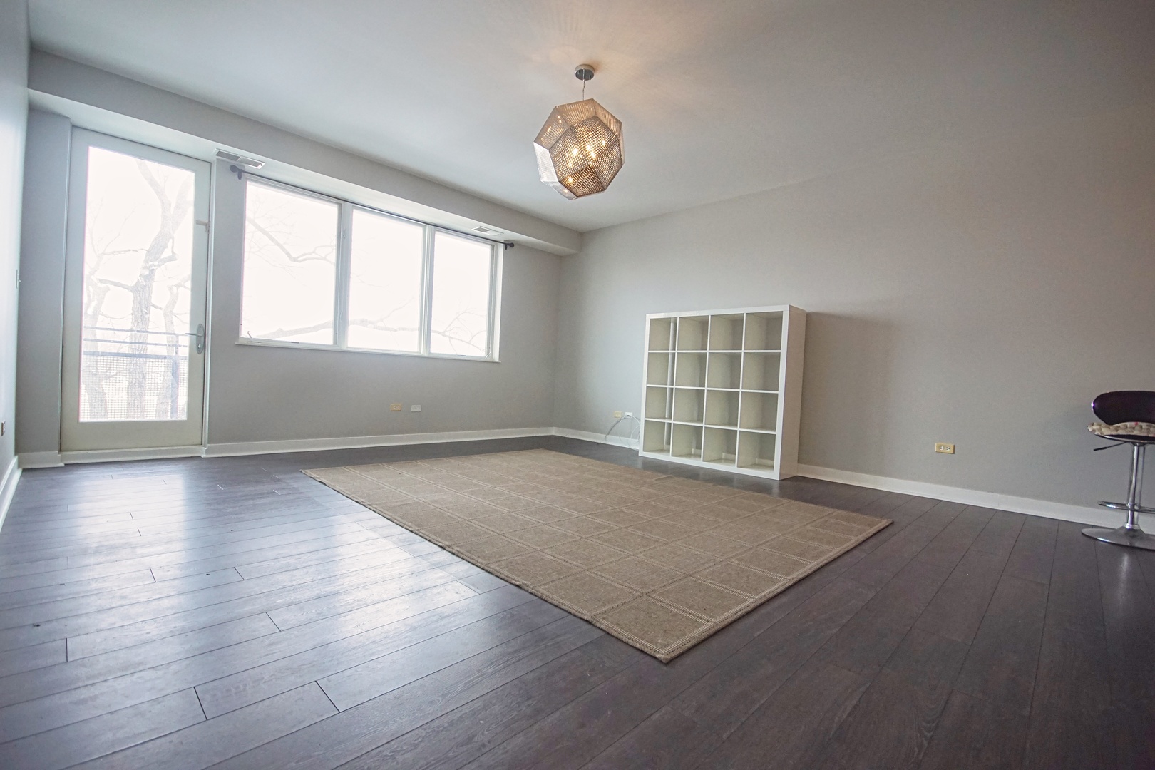 1905 South Wolf Road, Unit 401 Hillside, IL 60162 - Photo 7 of 22 an empty room with wooden floor and windows