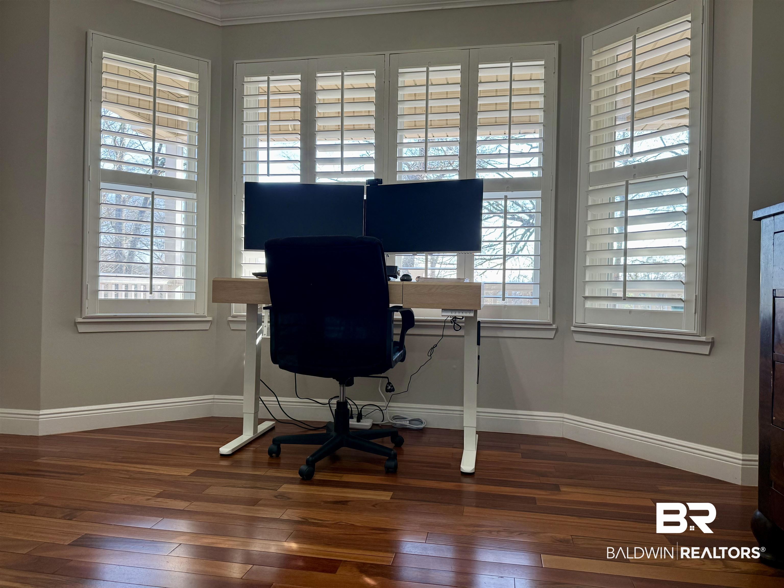 5646 Foshee Road Brewton, AL 36426 - Photo 25 of 37 Office space featuring dark wood finished floors and plenty of natural light
