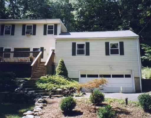 141 Mamanasco Road Ridgefield, CT 06877 - Photo 1 of 1 a view of a house with a yard