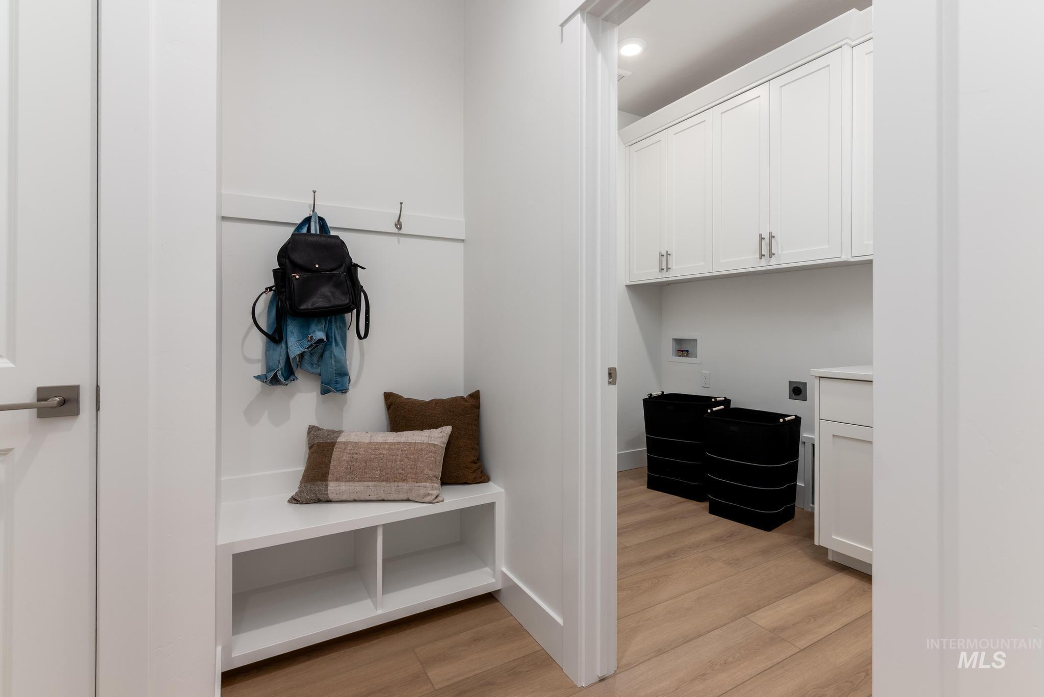 6285 West Snow Currant Street Meridian, ID 83646 - Photo 22 of 26 Built-in entryway bench with storage cubbies and wall hooks