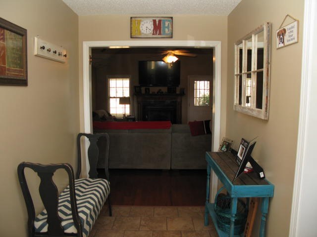 621 Homer Roberts Road Gray, GA 31032 - Photo 2 of 20 a living room with furniture and a mirror