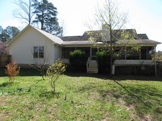 621 Homer Roberts Road Gray, GA 31032 - Photo 20 of 20 a backyard of a house with yard and outdoor seating