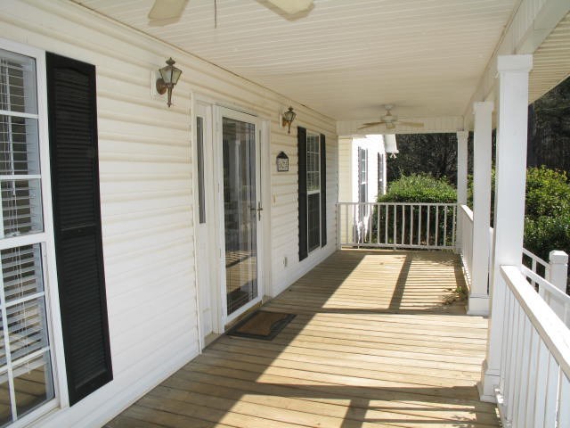 621 Homer Roberts Road Gray, GA 31032 - Photo 3 of 20 a view of a balcony with wooden floor