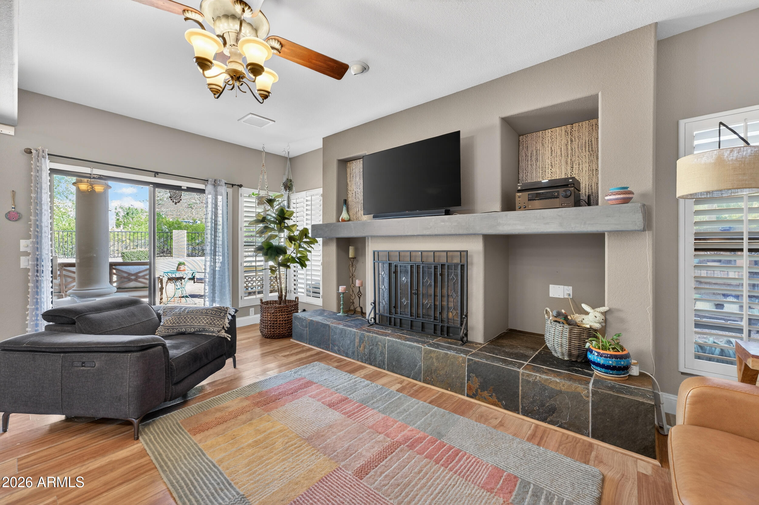 1539 East Winged Foot Road Phoenix, AZ 85022 - Photo 24 of 64 a living room with furniture and a fireplace