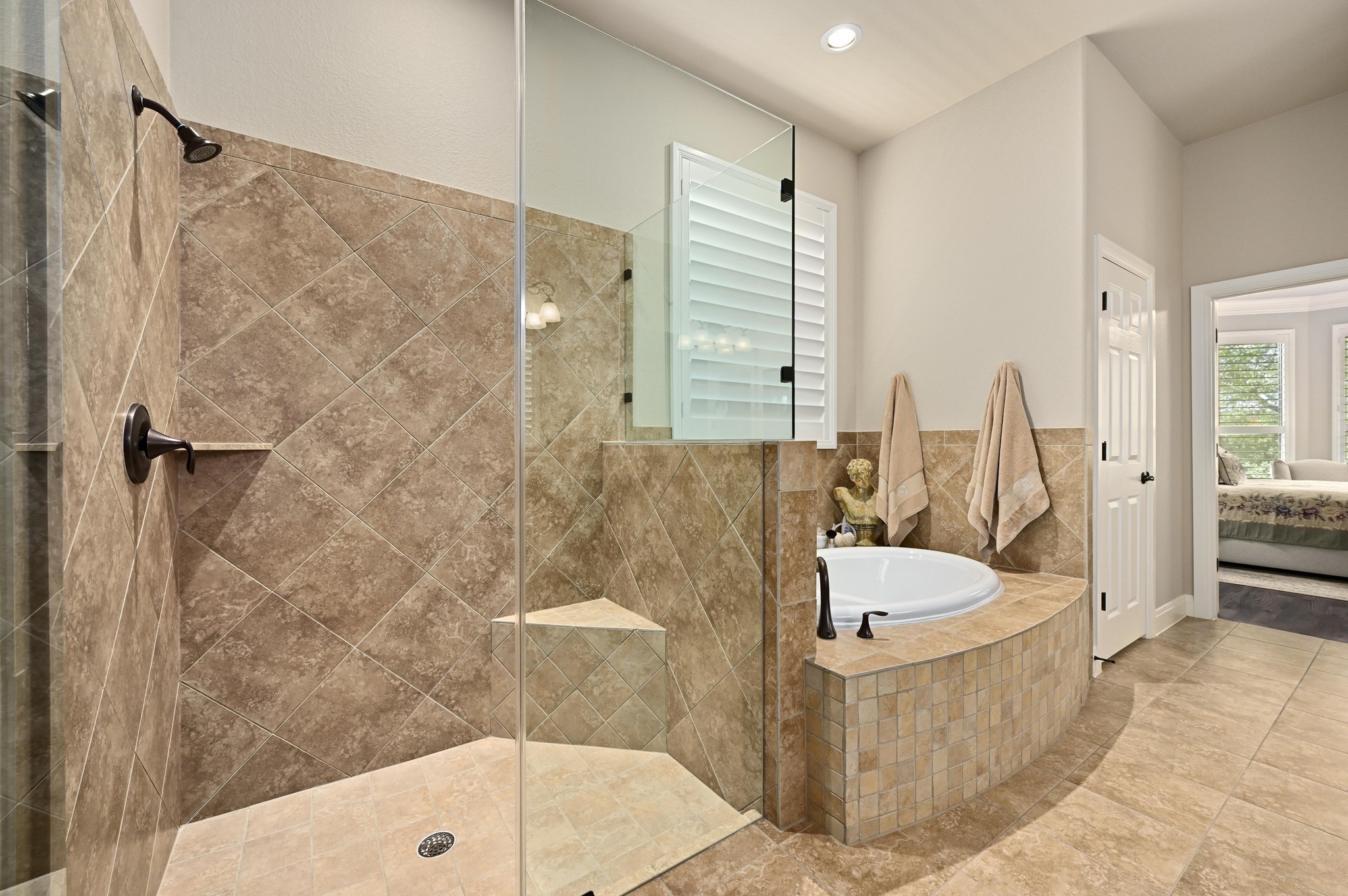 16129 Zagros Way Austin, TX 78738 - Photo 14 of 25 Primary Bathroom featuring a separate shower and garden tub