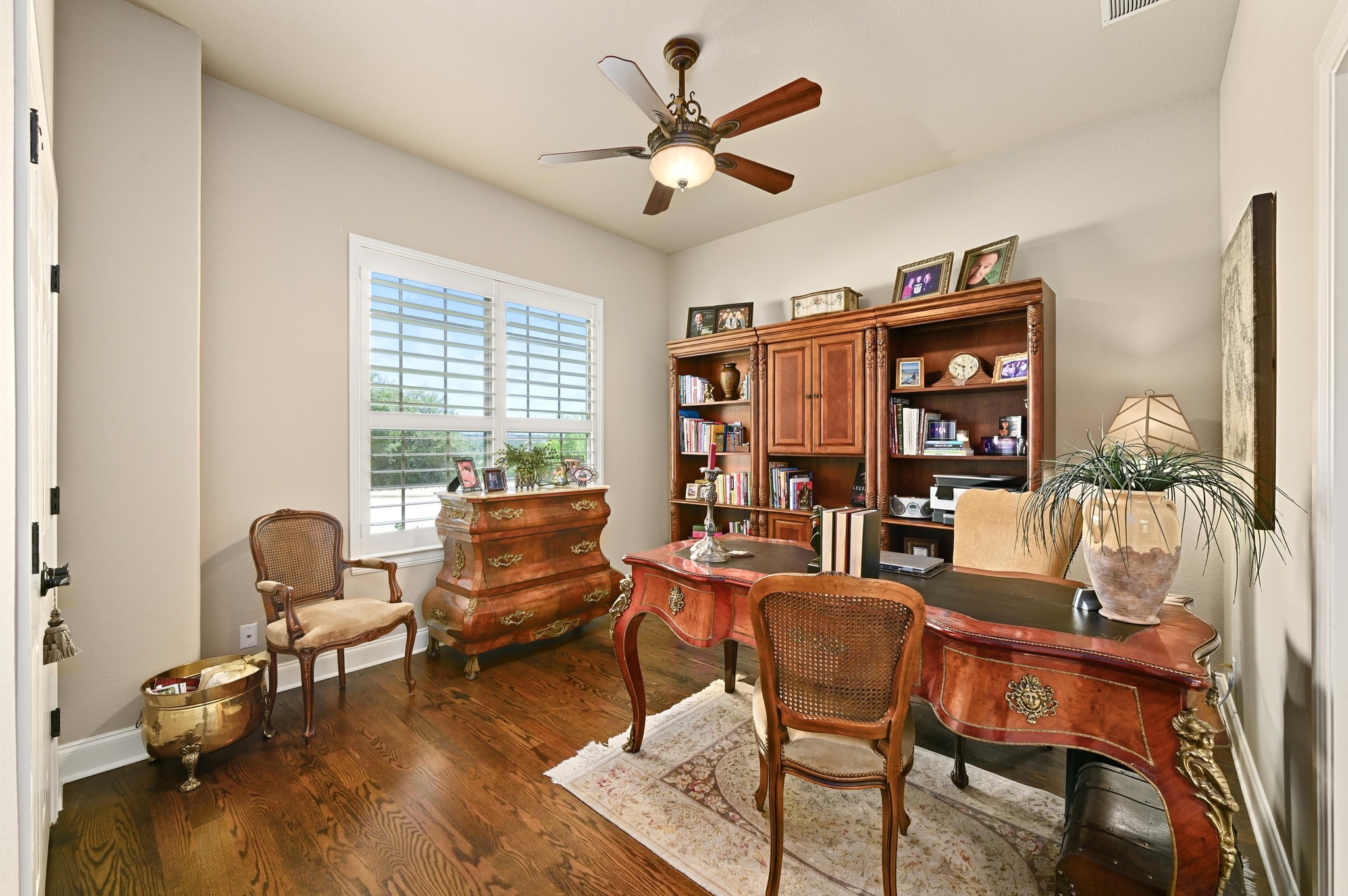 16129 Zagros Way Austin, TX 78738 - Photo 17 of 25 Bedroom or Office with wood flooring, ceiling fan and closet