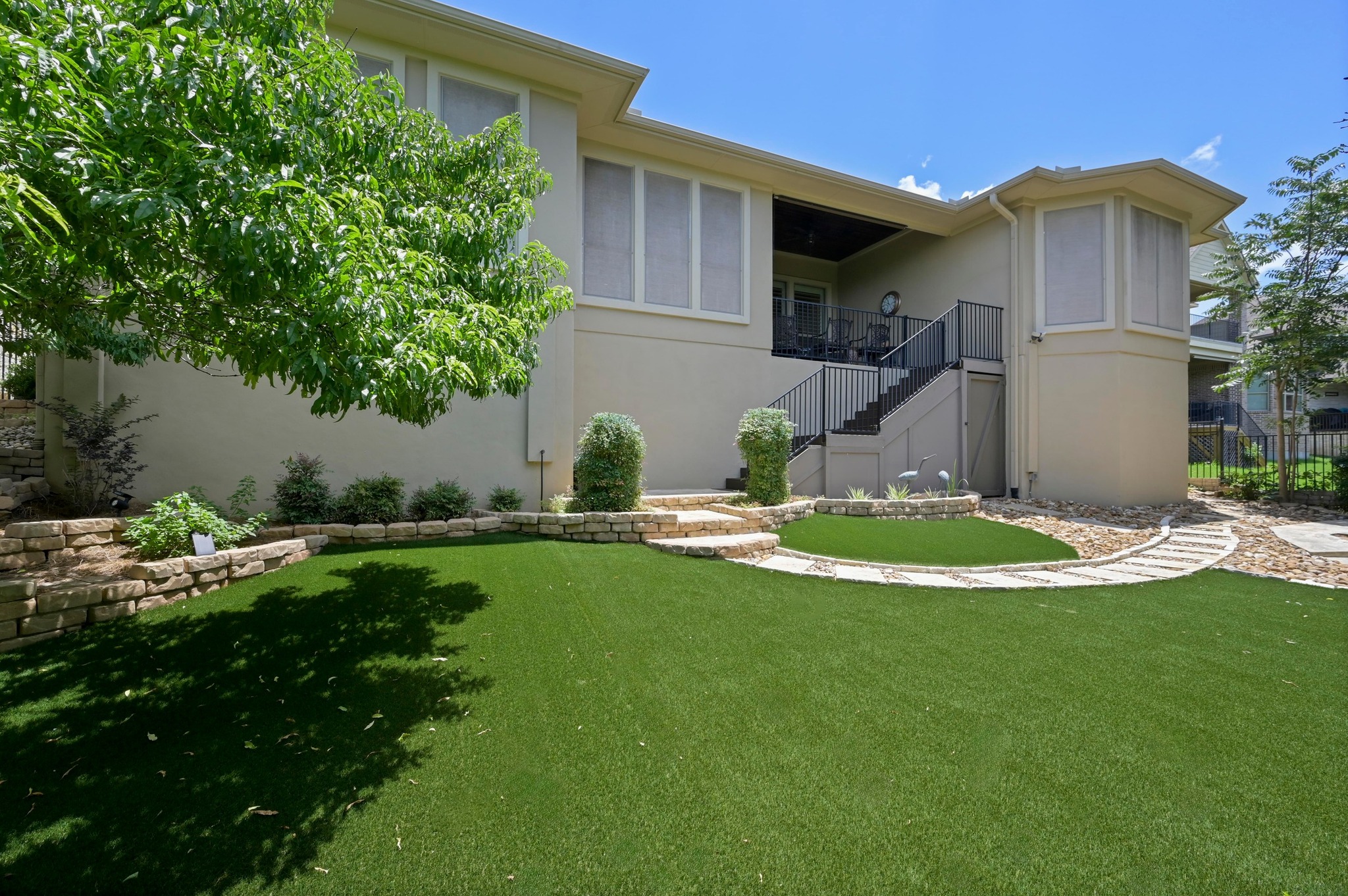 16129 Zagros Way Austin, TX 78738 - Photo 22 of 25 View of yard featuring artificial turf. No mowing needed.