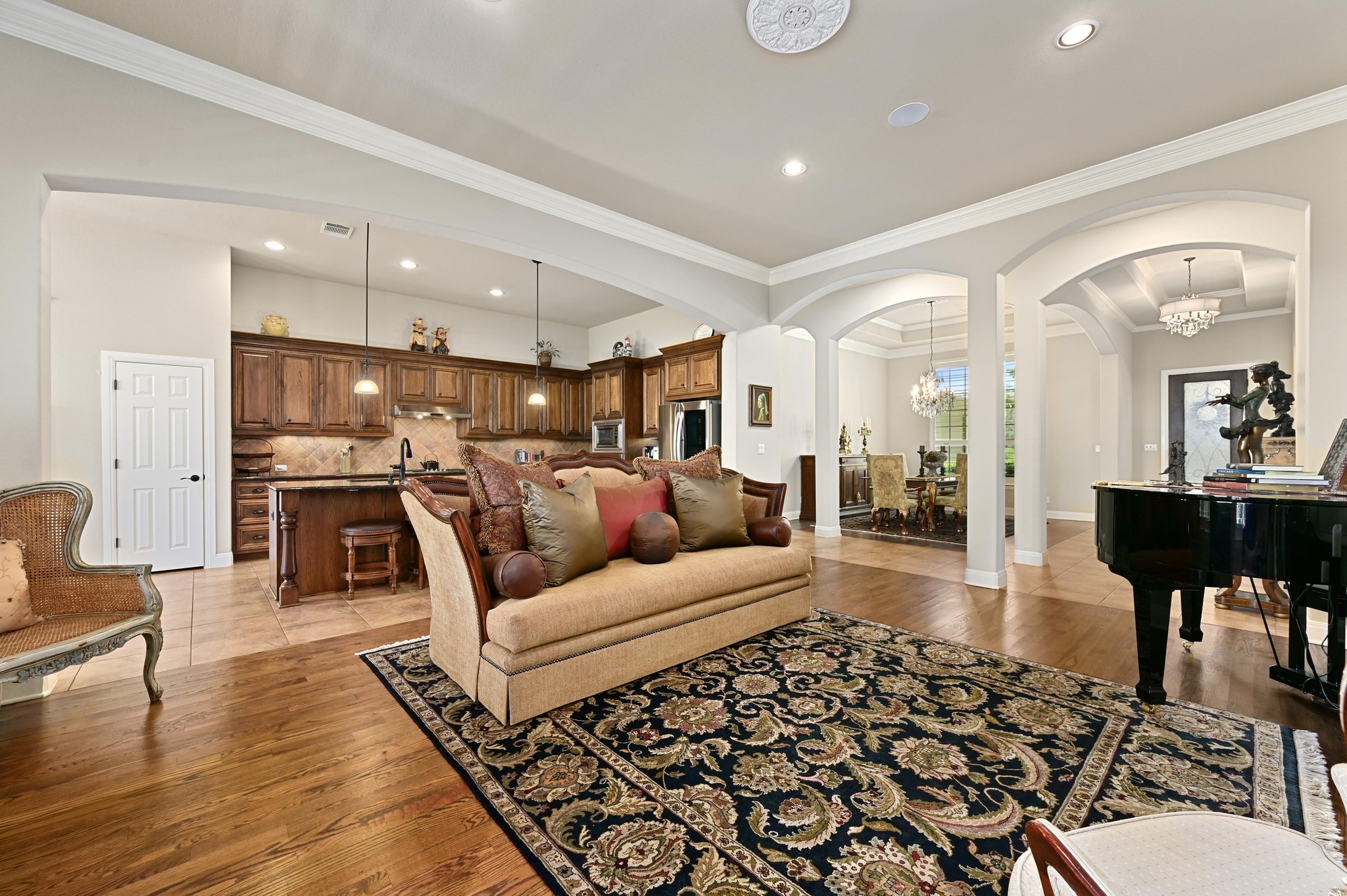 16129 Zagros Way Austin, TX 78738 - Photo 8 of 25 Living room with ornamental molding and wood floors