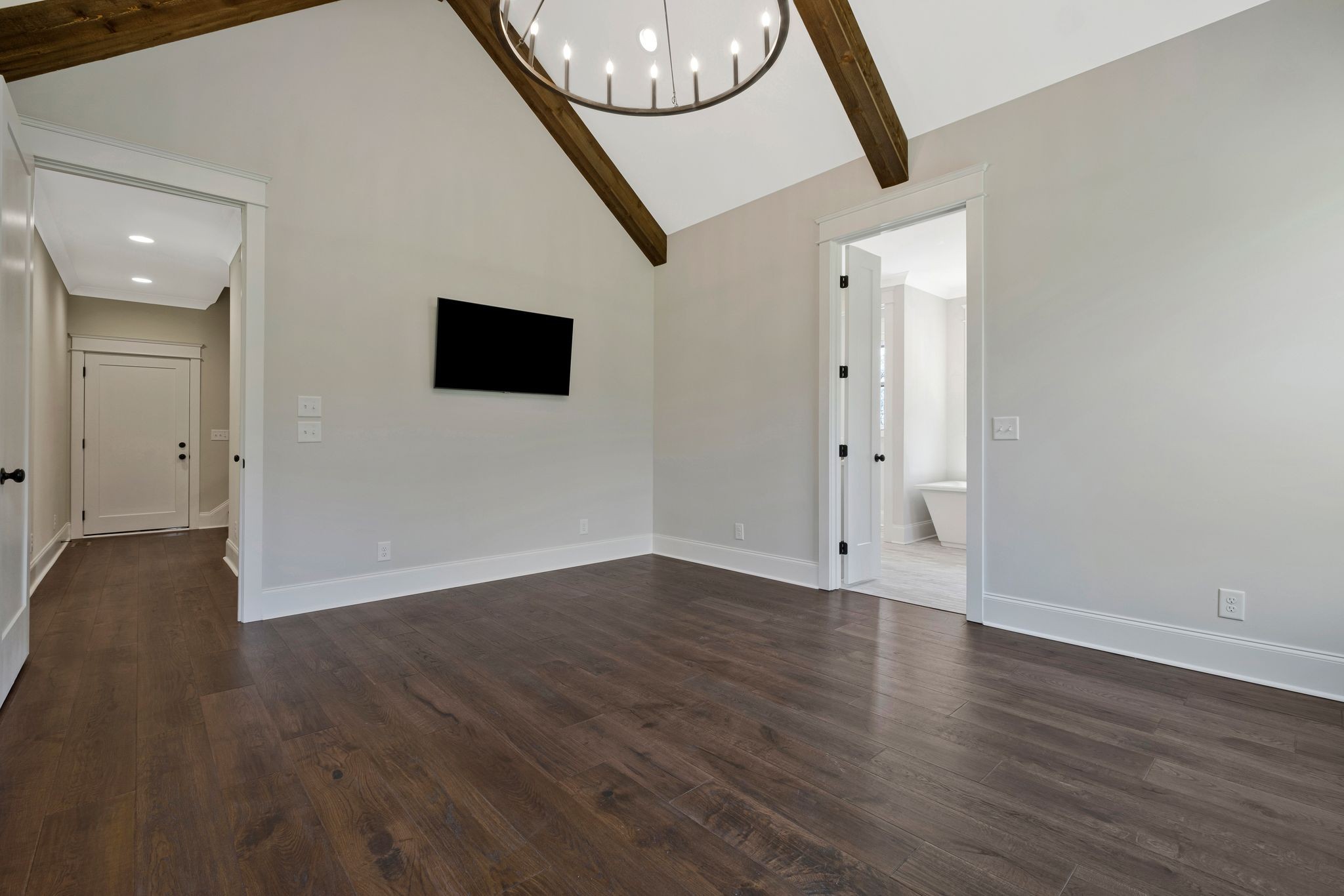 3050 Horn Springs Road Lebanon, TN 37087 - Photo 25 of 72 a view of an empty room with wooden floor and a mirror