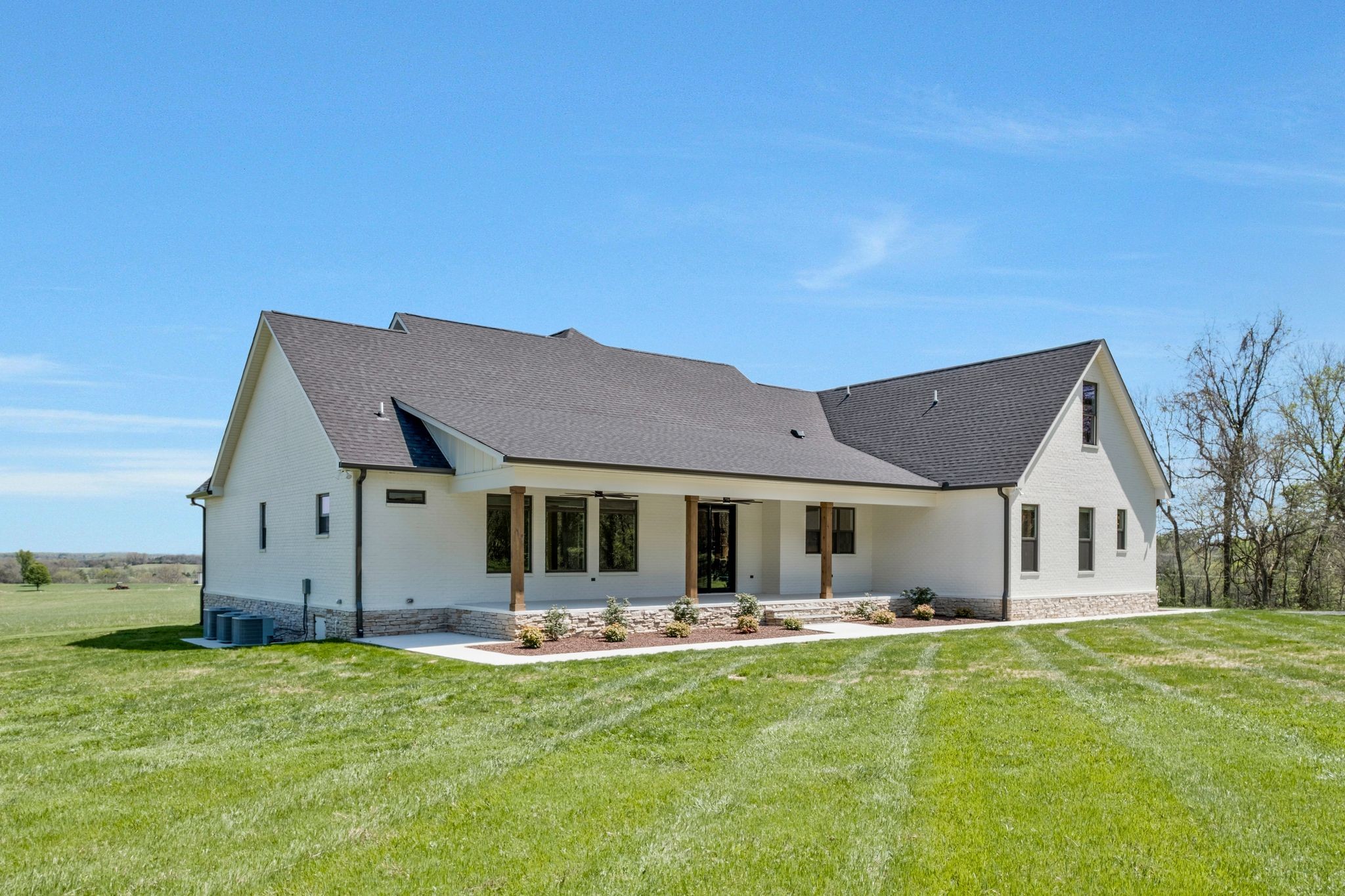 3050 Horn Springs Road Lebanon, TN 37087 - Photo 54 of 72 a front view of house with yard barbeque and wooden fence