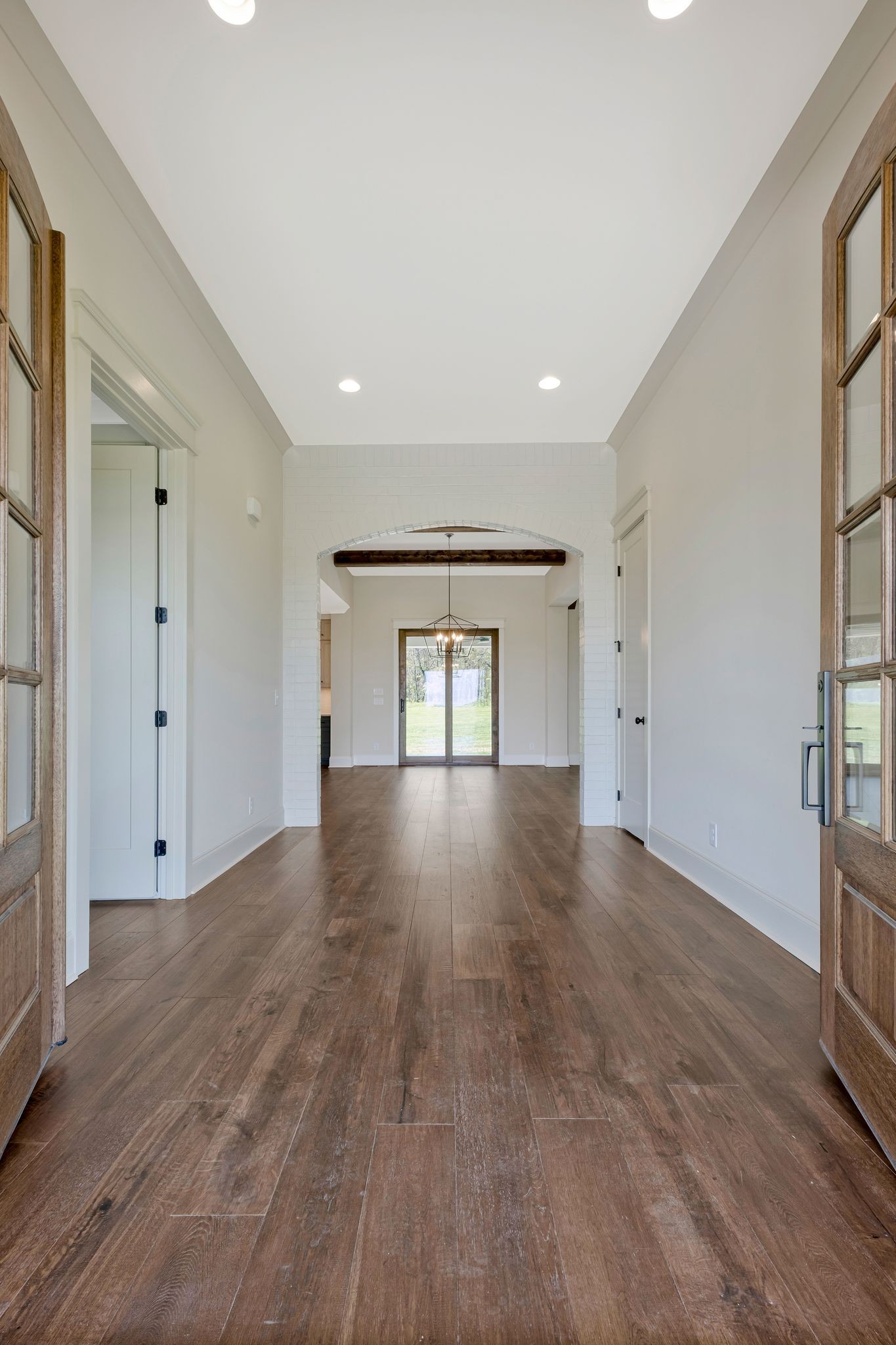 3050 Horn Springs Road Lebanon, TN 37087 - Photo 8 of 72 a view of an empty room with wooden floor and a window