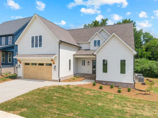 a spacious bedroom with a bed and a couch