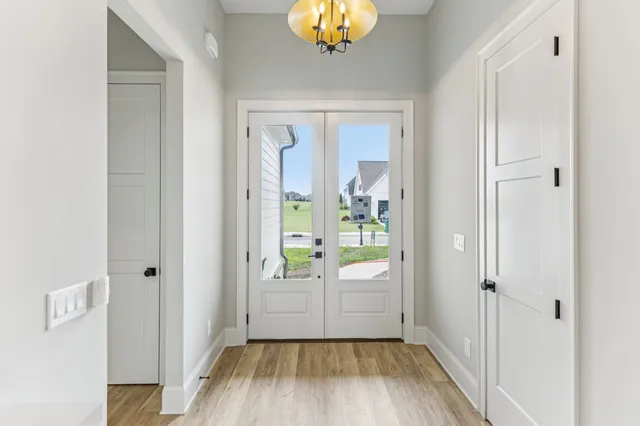 a view of bedroom and bedroom with wooden floor