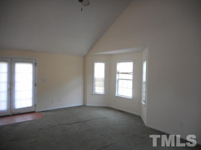 124 Forest Ridge Drive Willow Spring, NC 27592 - Photo 11 of 12 a view of empty room with windows
