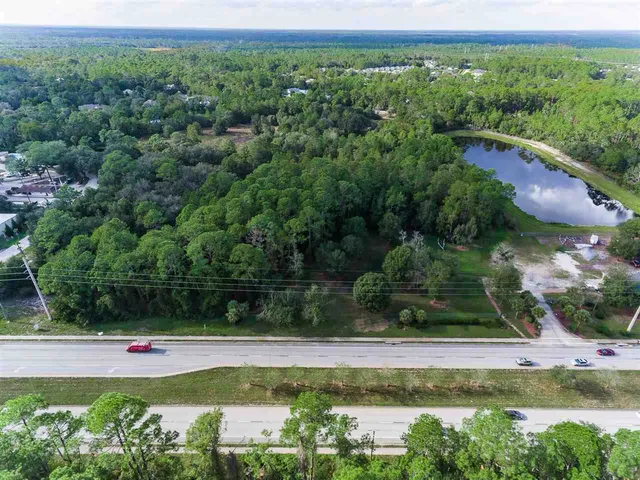a view of a swimming pool with a yard