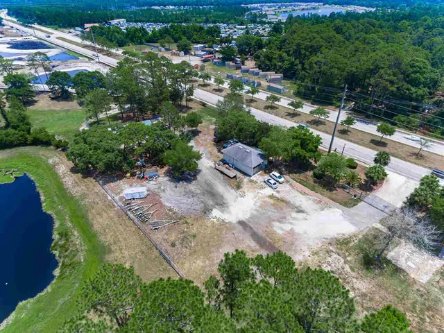 a view of a street with a yard
