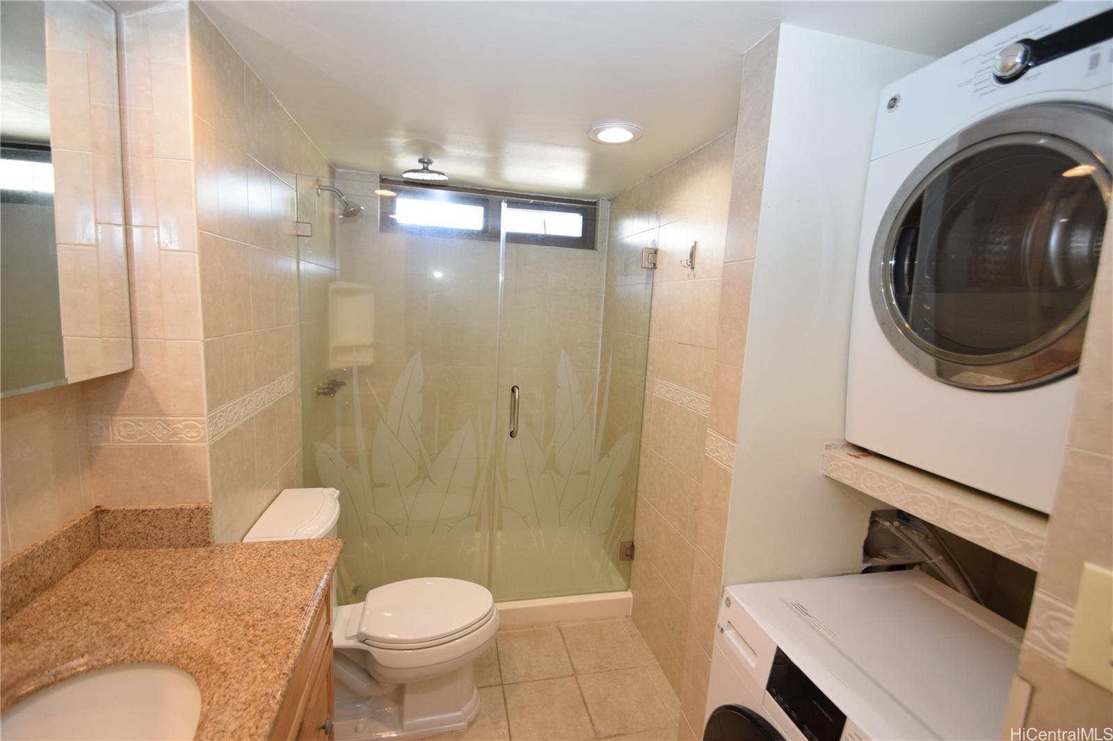 98-402 Koauka Loop, Unit 1916 Aiea, HI 96701 - Photo 15 of 24 a bathroom with a toilet a sink and a shower