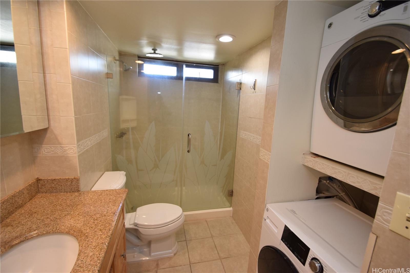 98-402 Koauka Loop, Unit 1916 Aiea, HI 96701 - Photo 16 of 24 a bathroom with a toilet a sink and a shower