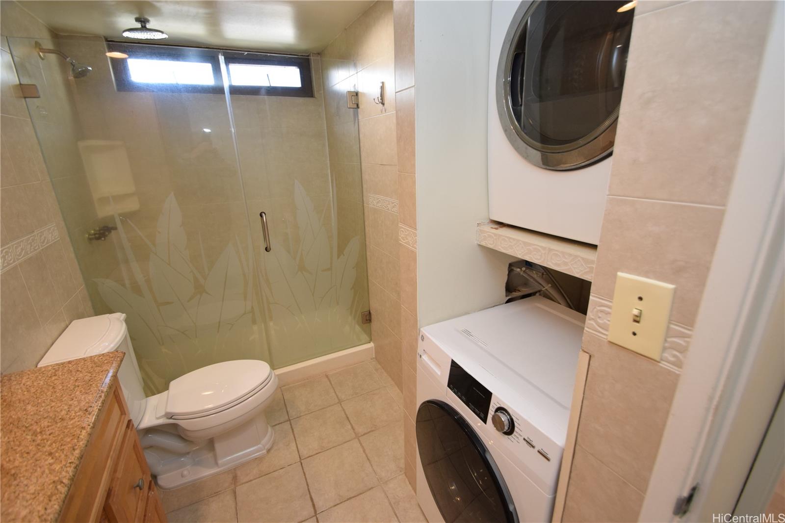 98-402 Koauka Loop, Unit 1916 Aiea, HI 96701 - Photo 19 of 24 a bathroom with a sink a toilet and shower