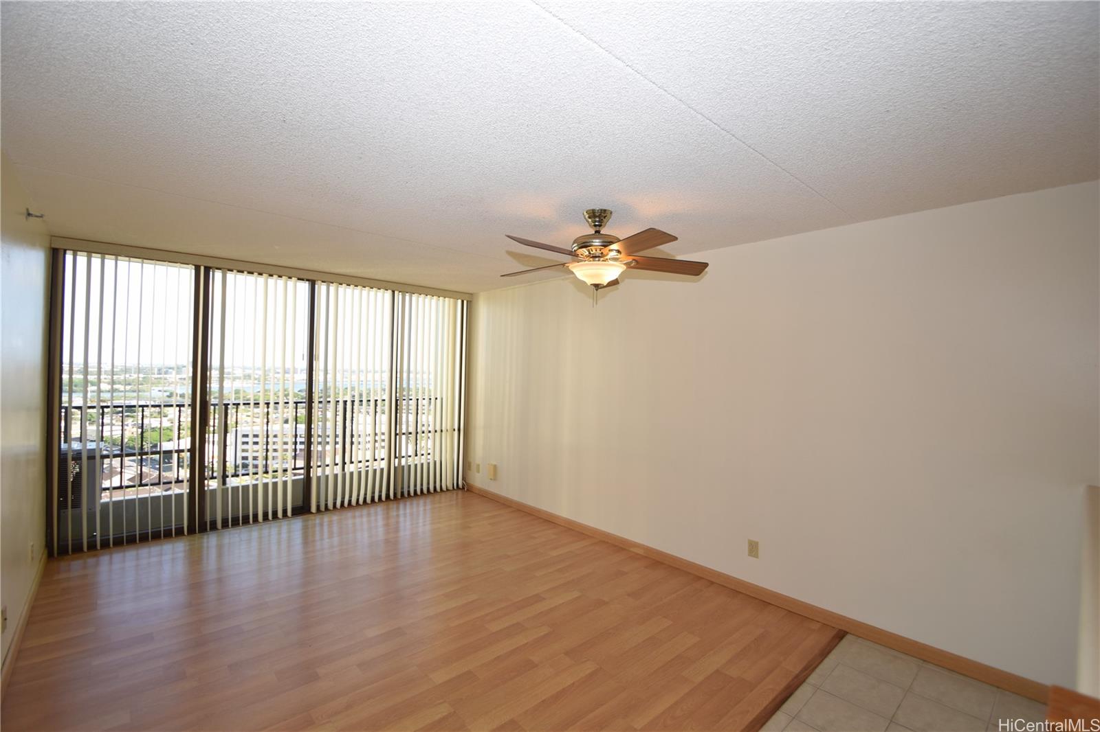98-402 Koauka Loop, Unit 1916 Aiea, HI 96701 - Photo 2 of 24 wooden floor in an empty room with a window