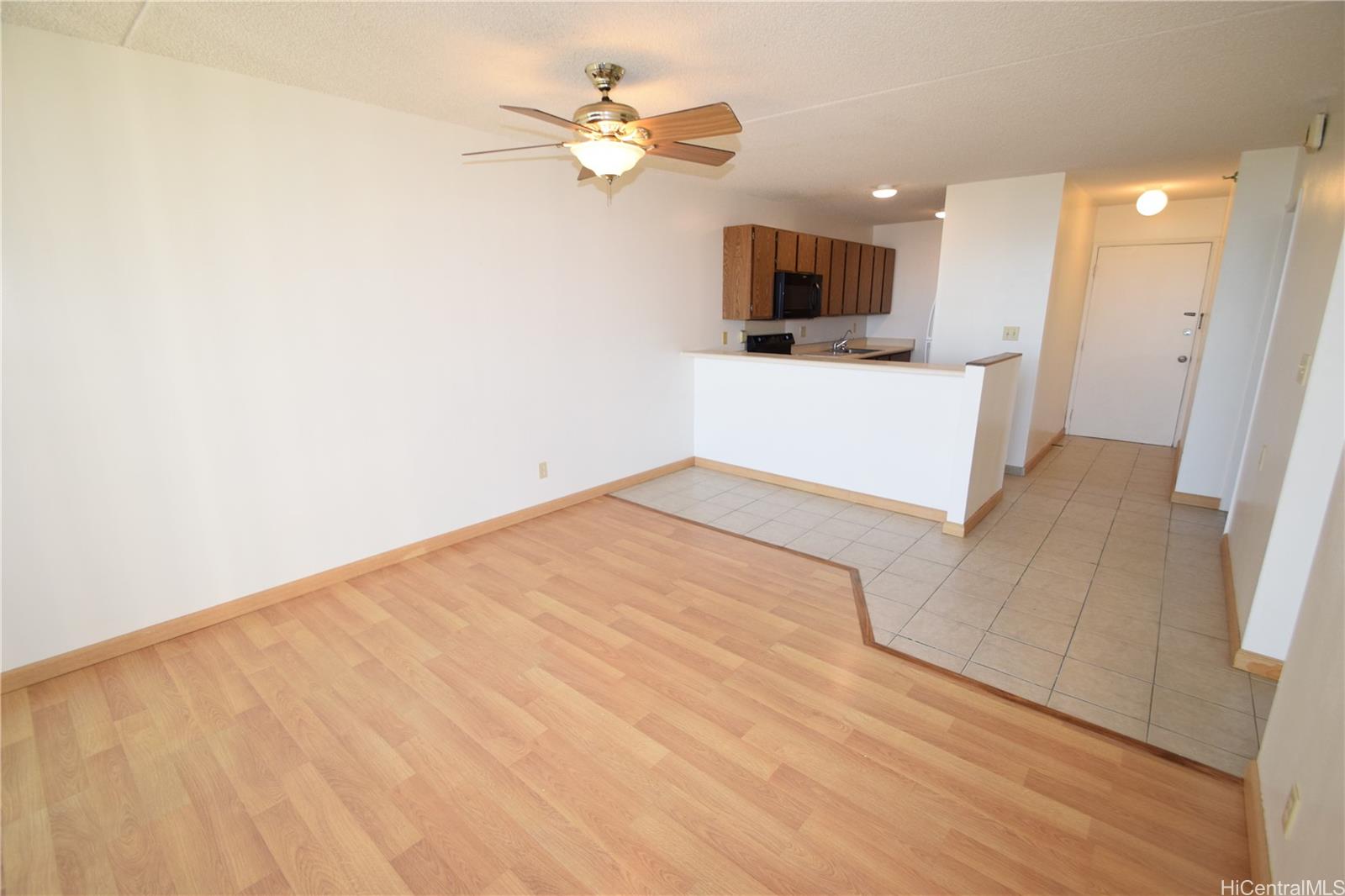 98-402 Koauka Loop, Unit 1916 Aiea, HI 96701 - Photo 24 of 24 a view of a livingroom with a flat screen tv