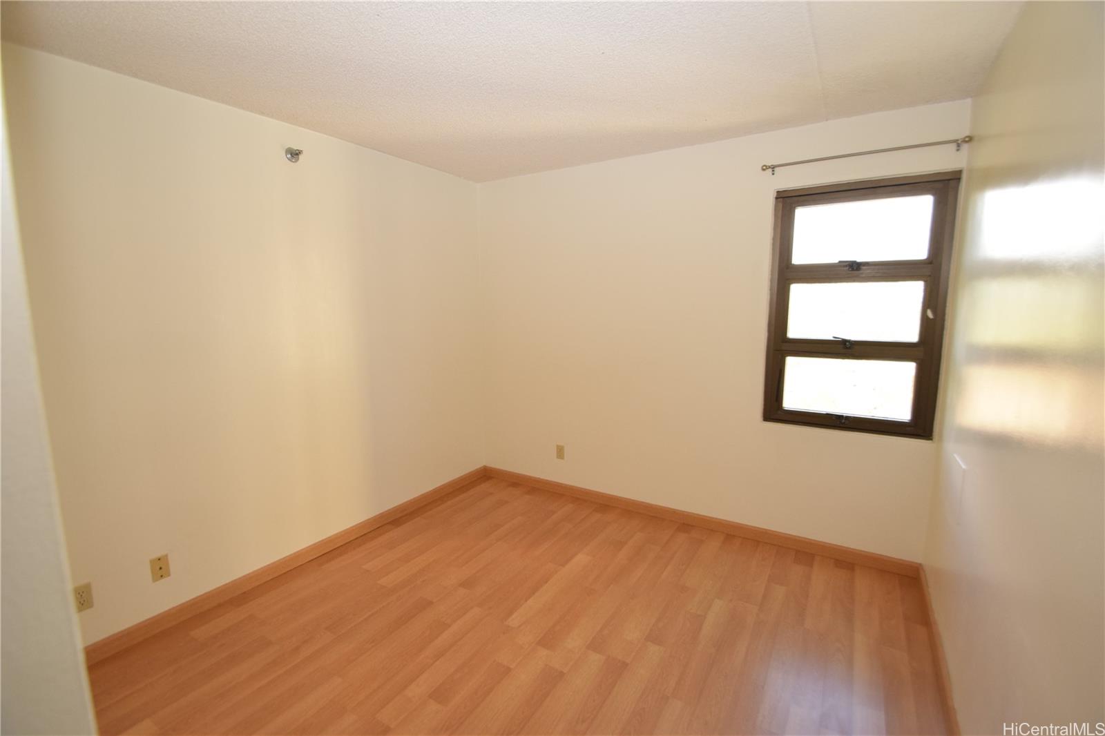 98-402 Koauka Loop, Unit 1916 Aiea, HI 96701 - Photo 9 of 24 an empty room with a window