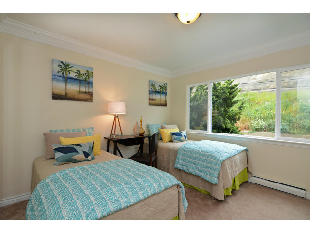 220 Beach Drive Aptos, CA 95003 - Photo 18 of 24 a bedroom with two beds and a large window