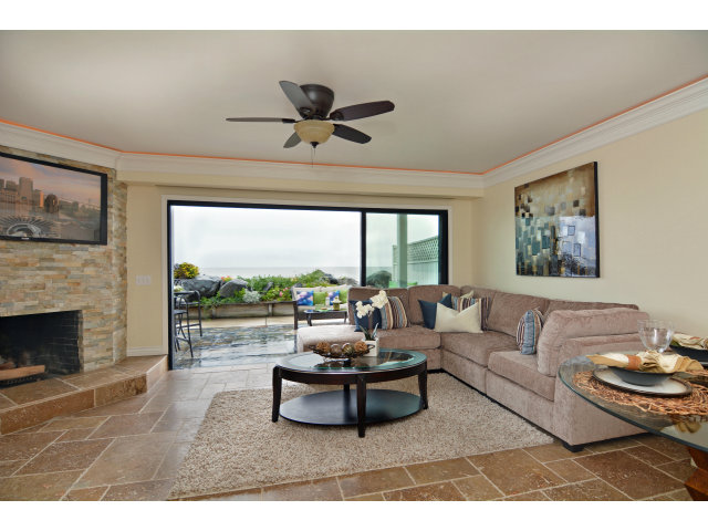 220 Beach Drive Aptos, CA 95003 - Photo 5 of 24 a living room with furniture a fireplace and a large window
