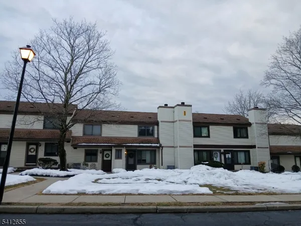 a view of house with yard