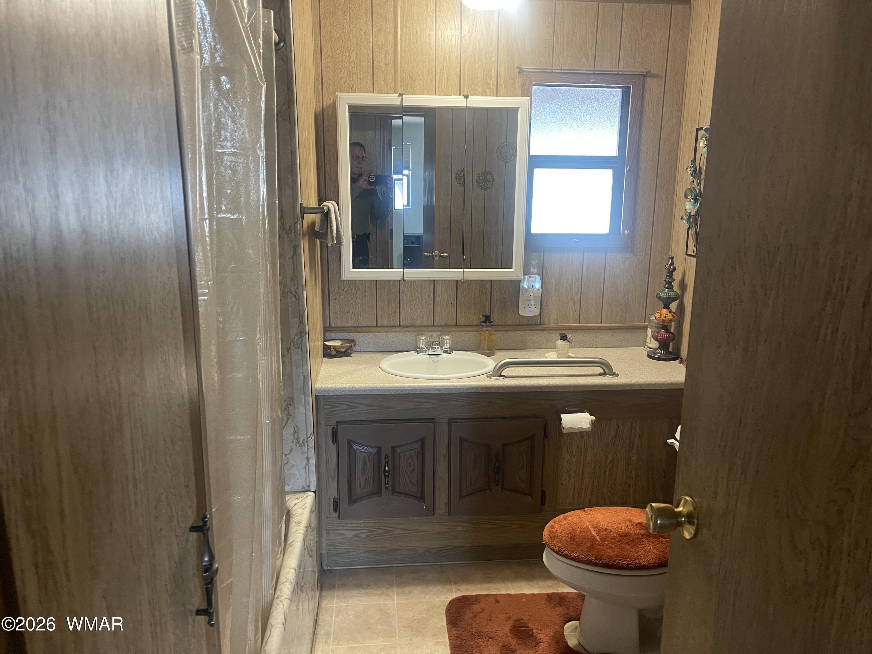 2871 Moose Trail Overgaard, AZ 85933 - Photo 10 of 25 a bathroom with a sink and a mirror