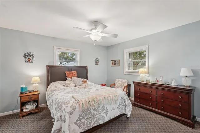 a bedroom with bed and window