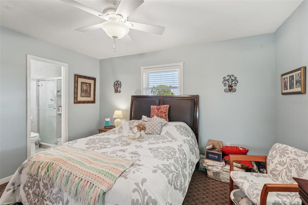 708 Rutgers Place Sun City Center, FL 33573 - Photo 15 of 27 a bedroom with bed and window