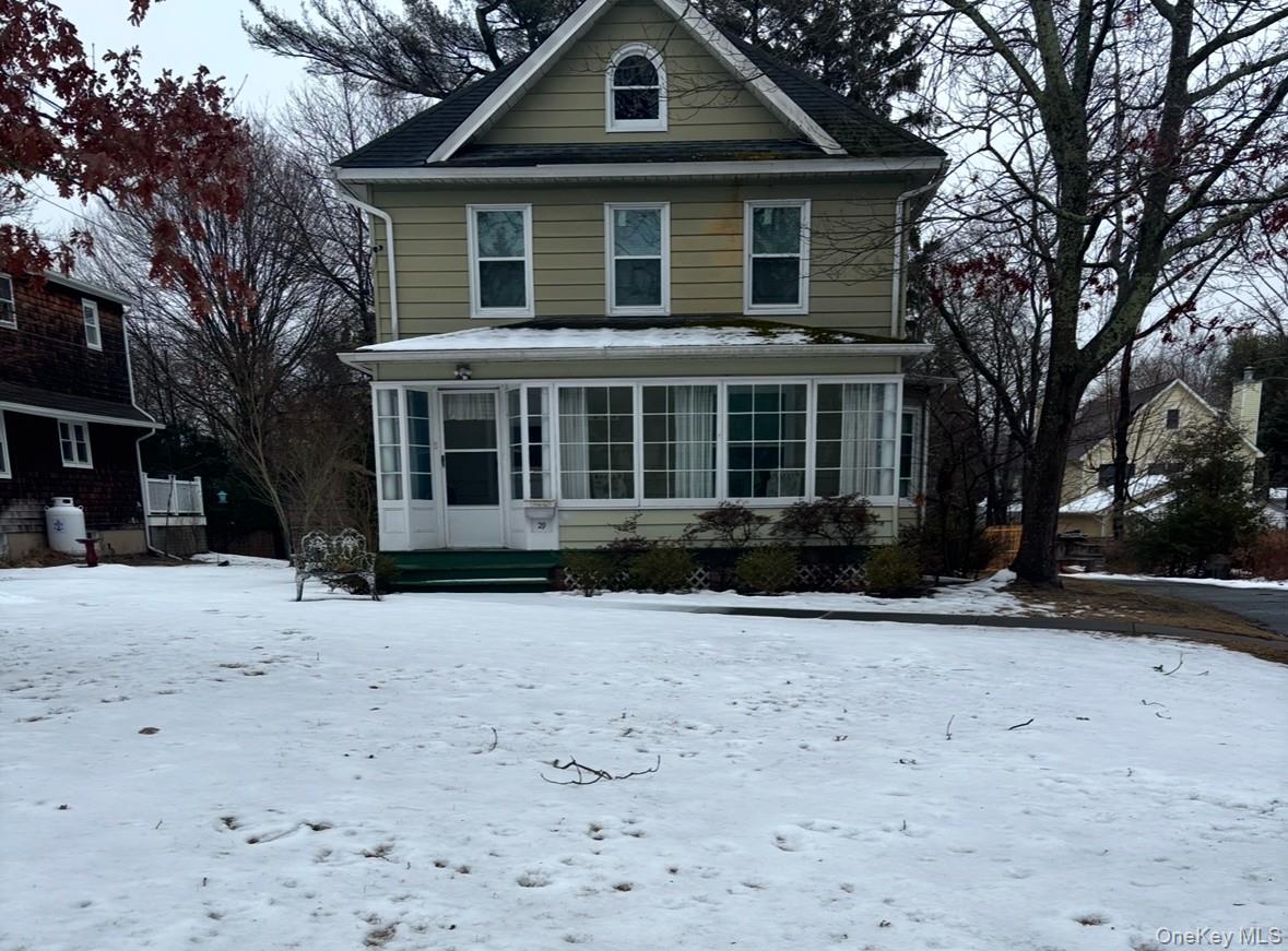 29 Beachfern Road Center Moriches, NY 11934 - Photo 1 of 1 a front view of a house with a yard covered in snow