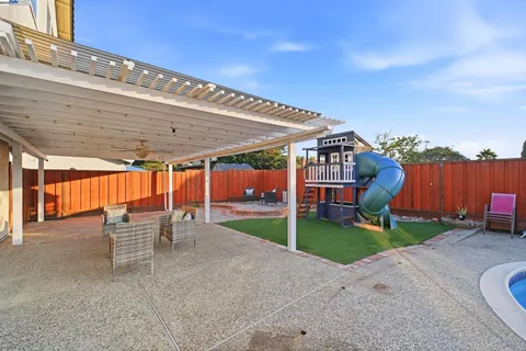a view of chairs and tables in the patio