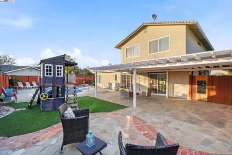 a front view of a house with a yard table and chairs