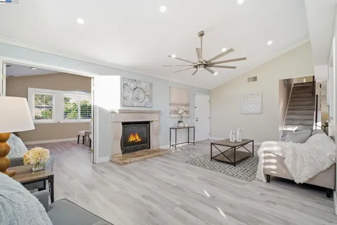a living room with furniture and a fireplace