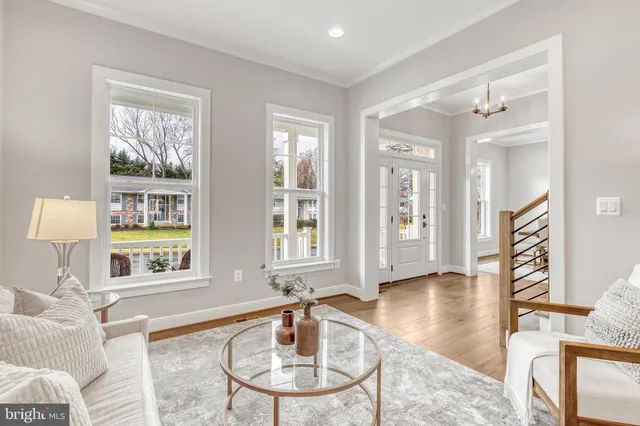 a view of a dining room with furniture wooden floor and flat screen tv