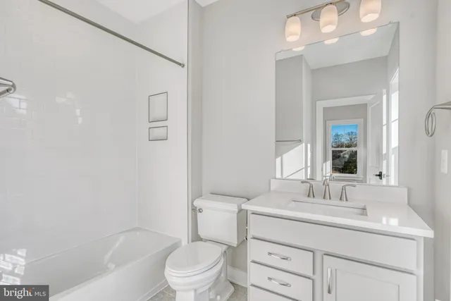 a bathroom with a double vanity sink mirror double vanity and bathtub