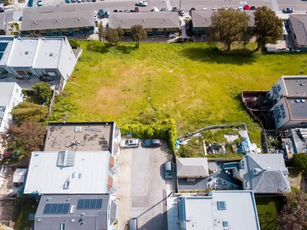 an aerial view of a house with a swimming pool