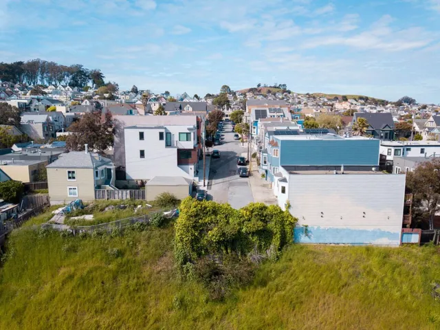an aerial view of a house with a garden