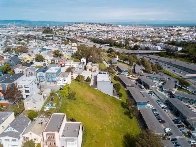 an aerial view of a city with lots of residential buildings
