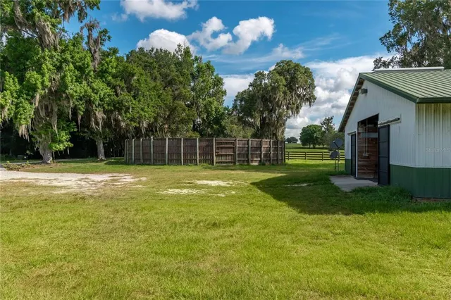 a backyard of a house with lots of green space