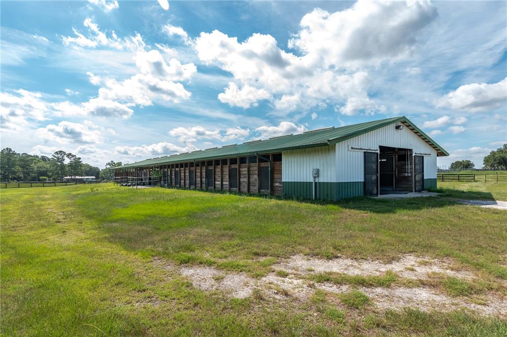 12520 Northwest 160th Street Reddick, FL 32686 - Photo 27 of 71 a backyard of a house with lots of green space