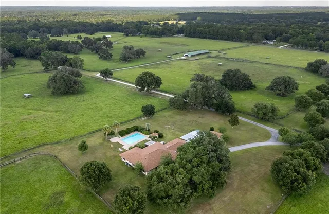 an aerial view of a houses with outdoor space and street view