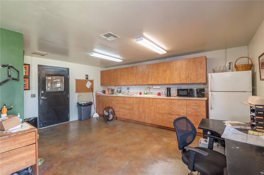 12520 Northwest 160th Street Reddick, FL 32686 - Photo 54 of 71 a view of workspace with a couch