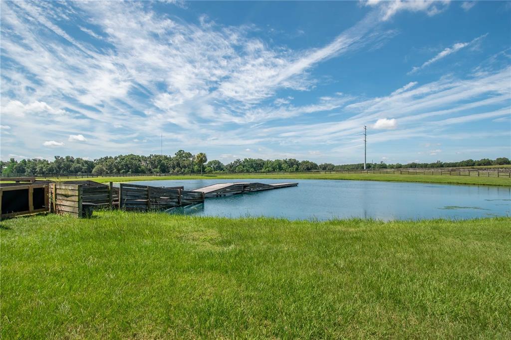 12520 Northwest 160th Street Reddick, FL 32686 - Photo 64 of 71 a view of a lake with houses in the back
