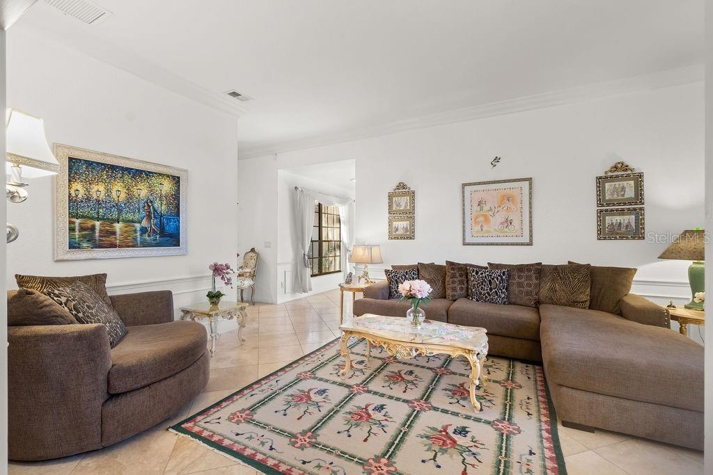 2958 Marquesas Court Windermere, FL 34786 - Photo 12 of 32 a living room with furniture and a couch