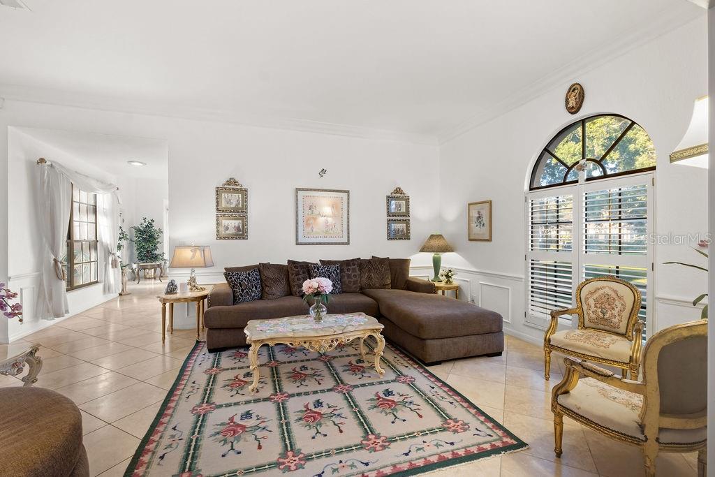 2958 Marquesas Court Windermere, FL 34786 - Photo 13 of 32 a living room with furniture and a large window