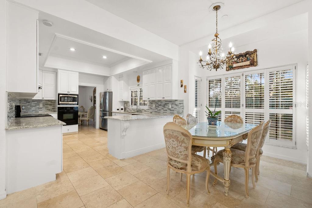 2958 Marquesas Court Windermere, FL 34786 - Photo 16 of 32 a view of a dining room with furniture and chandelier